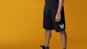 Man in Fearless Basketball Shorts on yellow background