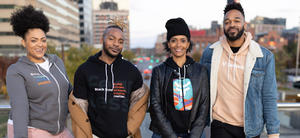Four models standing in the city with the new fearless sweatshirts