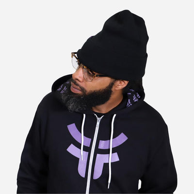 man with beard and glasses wearing black fearless zip up hoodie and black beanie