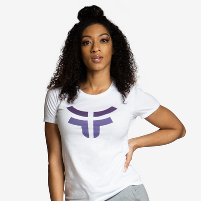 woman with hand on her hip wearing white classic logo tshirt