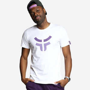 man wearing white fearless shirt and black fearless logo snapback